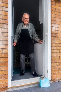 Senior citizen at front door