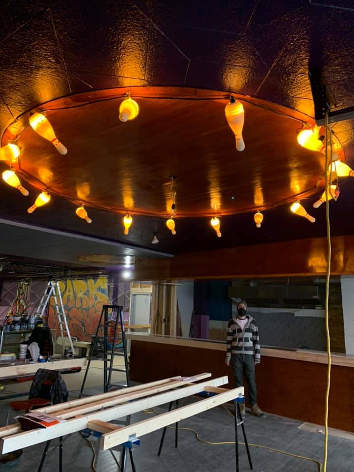 ring of light up bowling pins in ceiling 